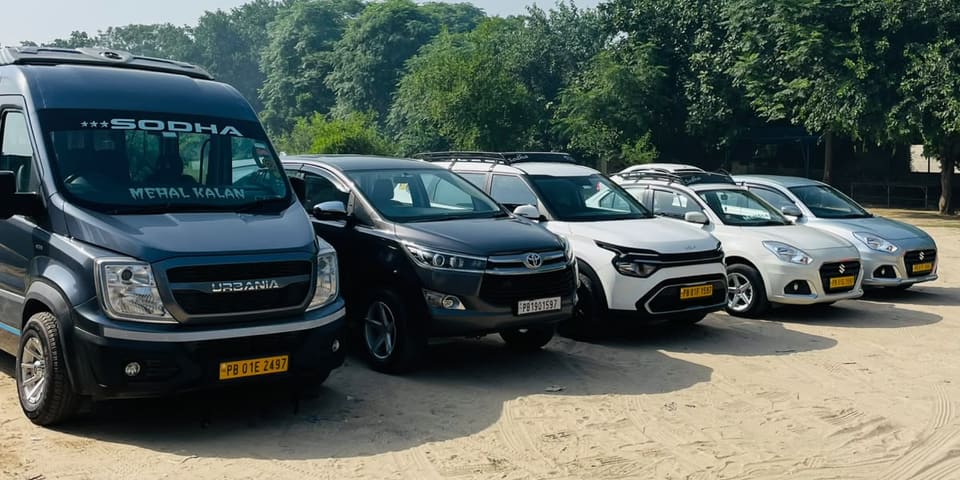 Sodha Tours & Travels vehicles parked in a row
